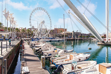 Ferris wheel at the marina of Genoa, Liguria, Italy. Marina in the "Porto Antico" of Genoa.