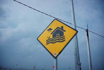 signs for no swimming on the beach. Information no swimming sign on Blue Sky Background. warning symbol: Malang, indonesia -28 Dec 2021