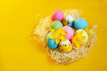 easter eggs in a basket. Yellow background. Christianity. Celebrate holidays 