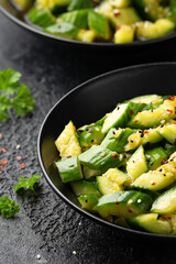 Smashed cucumber spicy Asian style salad with soy sauce dressing, chilli flakes, garlic and sesame seeds