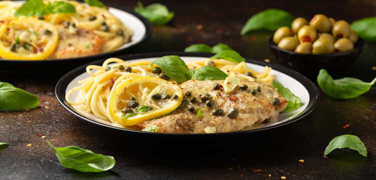 Chicken Piccata with capers, white wine sauce and spaghetti. Italian food