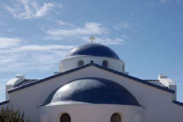 Fototapeta na wymiar Partial view of a Greek Orthodox church under blue sky