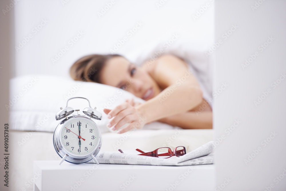 Sticker Waking from her slumber. A young woman waking up and reaching over to her alarm clock.