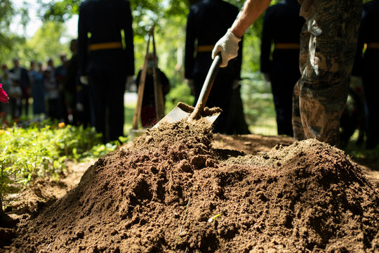 Man Digs Grave. Worker With Shovel. Mounding.