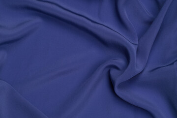 Beautiful indigo color silk fabric texture background.