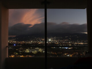 View of San José City during dusk from a room