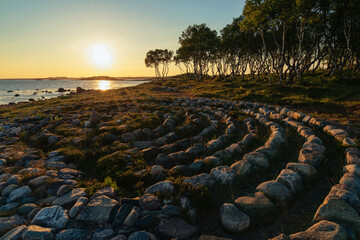 View of the stone labyrinth on the shore of the White Sea on a sunny summer day, Solovetsky Island,...