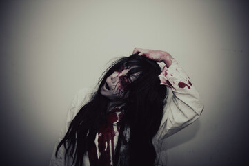 Portrait of asian woman make up ghost,Scary horror scene for background,Halloween festival...