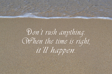 Motivational and inspirational quote on sandy beach background.