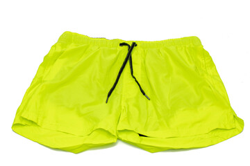 A man's swimsuit, fluorescent yellow. Isolated on white background. Male fashion concept.
