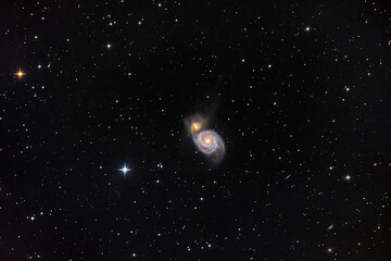 The Whirlpool Galaxy and NGC5194 in dark black space