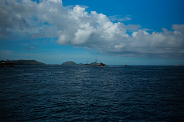 sailing ship on the sea under beautiful clouds