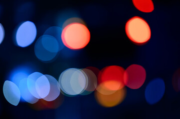 Abstract twinkling lights background with bokeh defocused multicolored lights, valentines day...