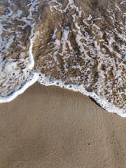 Beach sand and sea foam