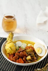 Ketupat or lontong sayur, Indonesian cuisine, Special dish served at Eid Mubarak /Eid Fitr celebration.