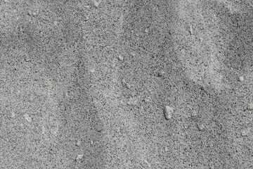 Sand Texture. Black and white sand. Background from fine sand. Close-up image