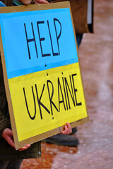 poster help ukraine, with the colors of the flag in a protest against the war in Ukraine. stop war