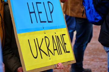 poster help ukraine, with the colors of the flag in a protest against the war in Ukraine. stop war
