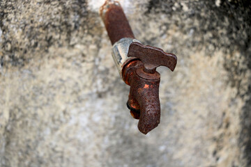 Portrait view of rustic broken water tap