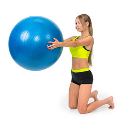 A shapely woman is exercising with a rehabilitation ball