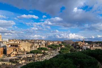 Fototapeta na wymiar Rome, Italy: View of ancient Trajan forum and Colosseum from the Memorial of Victor Emmanuel II