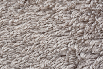 Macro of soft textile, Close up of short pile brown carpet woven, Fluffy fiber fabric cloth feels warm and comfortable.