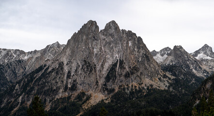 Fototapeta na wymiar dark high alpine peak with sharp rocky formation high resolution panoramic shot 
