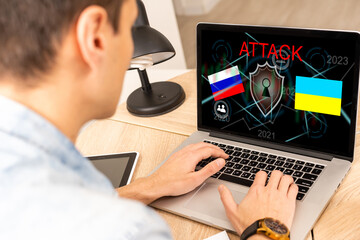 Computer hacker or Cyber attack concept background with Ukraine flag and the Russian bear-hacker