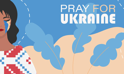 Pray for Ukraine. A girl is crying in an embroidered shirt against the background of the colors of the Ukrainian flag. Banner in support of Ukraine.