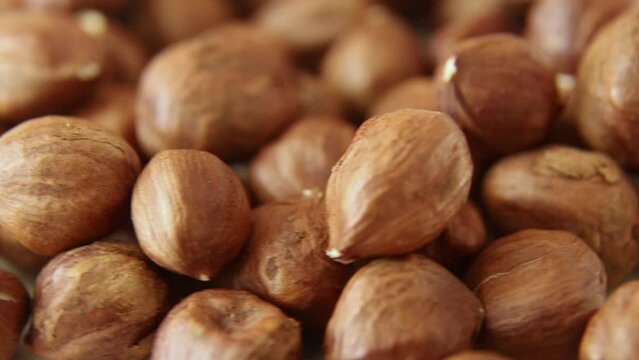 Hazelnuts are a cyclical movement. Lots of filbert. Food. Close-up. Macro.
