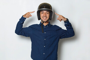 handsome man with a motorcycle helmet showing a thumbs up ok gesture on white background
