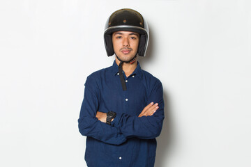 handsome man with a motorcycle helmet showing a thumbs up ok gesture on white background
