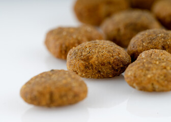 Fototapeta na wymiar close up of dog food pellets on white background