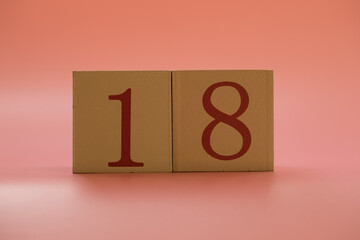 Numbers or dates on wooden cubes, eighteen