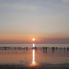 sunset on the beach, sun, colorful sky