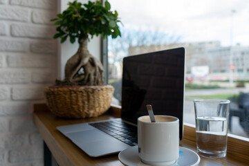 Work office with computer and coffee