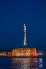 The Madonnina del Faro in the Strait of Messina in the middle of the sea at the entrance to the naval port.