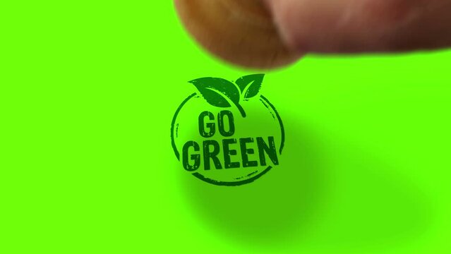 Go green and eco friendly symbol stamp and hand stamping impact isolated animation. Co2 neutral, ecology, environment, nature and climate 3D rendered concept. Alpha matte channel.