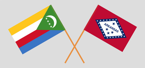Crossed flags of the Comoros and The State of Arkansas. Official colors. Correct proportion