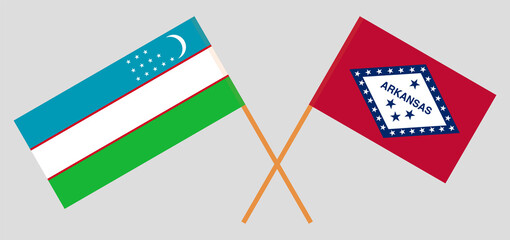 Crossed flags of Uzbekistan and The State of Arkansas. Official colors. Correct proportion