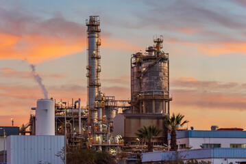 Installations of an oil refinery at sunset