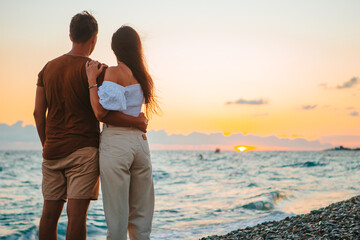 Young couple on white beach during summer vacation.