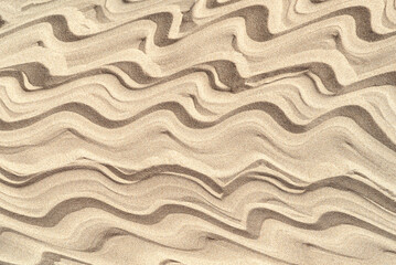 Texture of sea sand background closeup with ornament