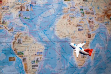 Fototapeta na wymiar toy passenger plane flies over the map of Africa