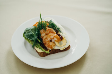 sandwich with shrimp, cucumber, egg and herbs