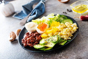 breakfast, wheat porridge with boiled egg and fresh vegetables