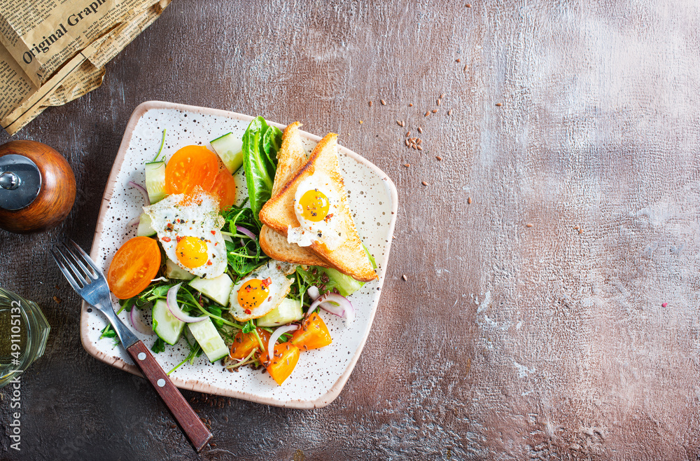 Canvas Prints fried eggs with vegetables, top view, diet salad with quail eggs