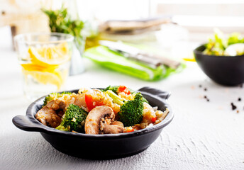 vegetarian stir fry in black pan, vegan food
