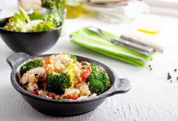 vegetarian stir fry in black pan, vegan food