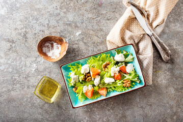 salad with white cheese and vegetables on plate